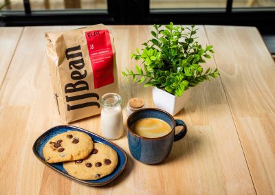 cookies, milk, coffee and a bag of coffee beans