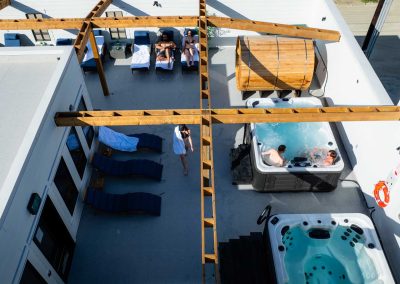 people relaxing in a Jacuzzi at roof top spa