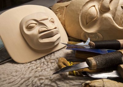 carving of a figure of an aborignal face