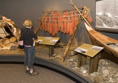person looking at an aboriginal display in a museum