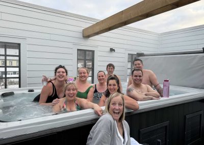 people smiling while in a jacuzzi