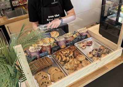 person arranging pastries on a tray