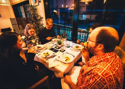 people smiling while having dinner