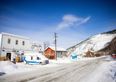 snow covered road and mountain