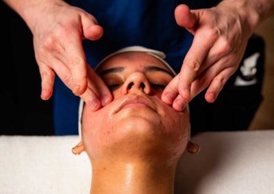 person having a facial massgae