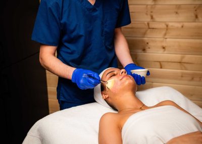 cream being applied to a person's face