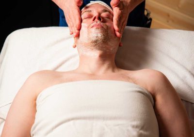 person having his face massaged