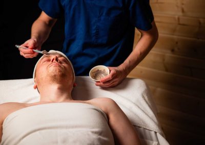 cream being applied to a person's face